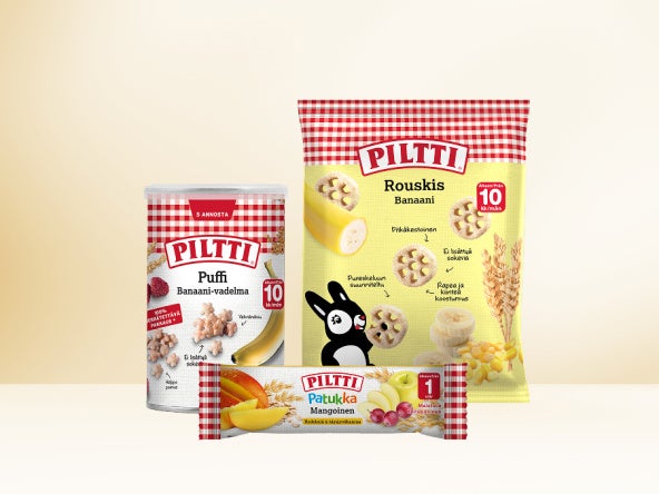 Kolme Piltti-lastenruokatuotetta vaaleaa beigettä taustaa vasten.