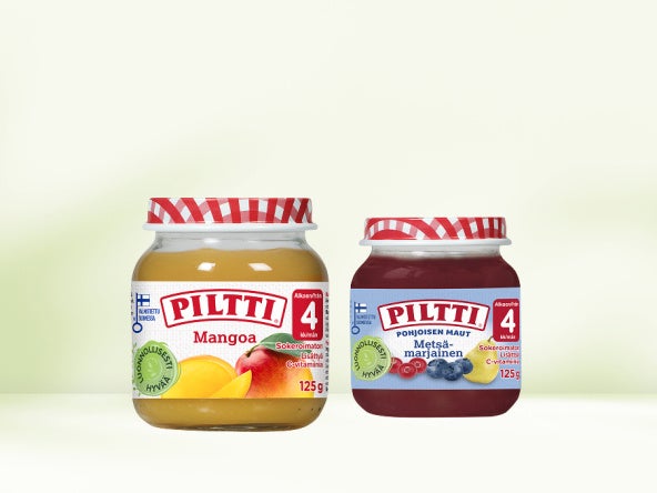 Kaksi Piltti-purkkia vaaleaa taustaa vasten. 